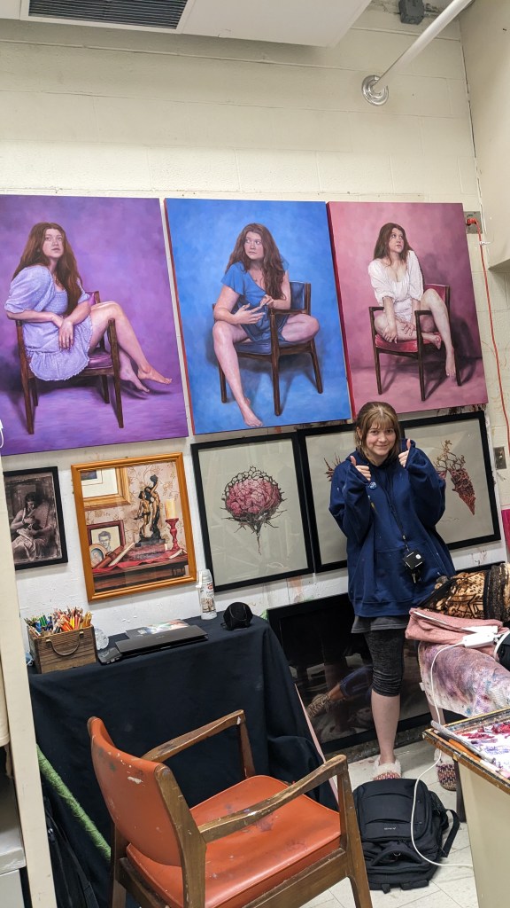 Here I am, dead on my feet after hours of painting right before finals in Spring 2023. My roommate took this picture around 1am when I hung Pink up to dry and we saw all three together for the first time!
