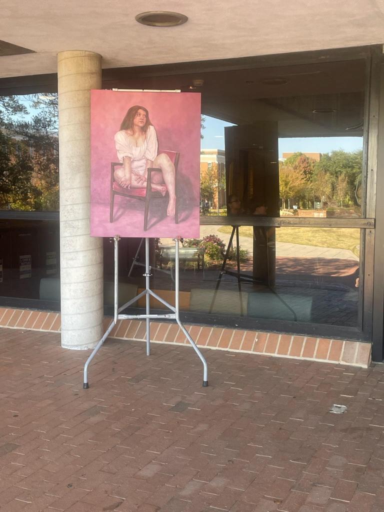 Woman in Pink was borrowed by COAA during UNC Charlotte's Open House in 2023 and displayed at the front doors of Rowe Arts!